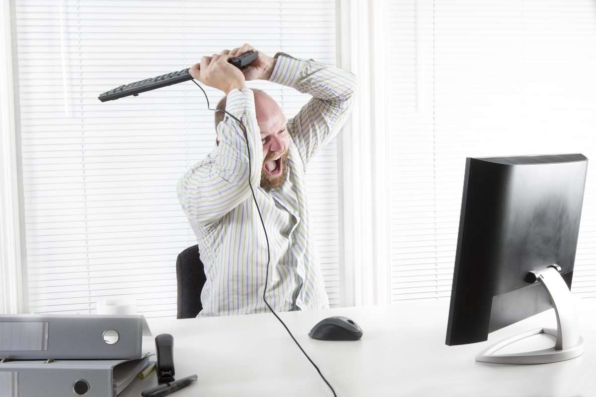 graphicstock office worker businessman attacks his computer with a keybeard rugtCLsfix