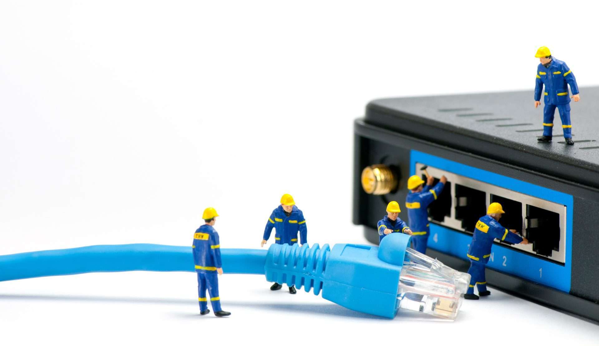 Computer Networking 2 technicians connecting network cable zkAdn9A scaled